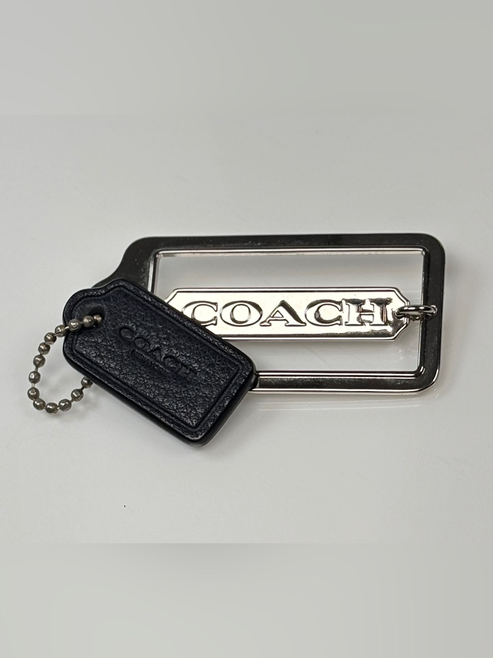 COACH hang tag set;  small Black Leather and medium silver metal.